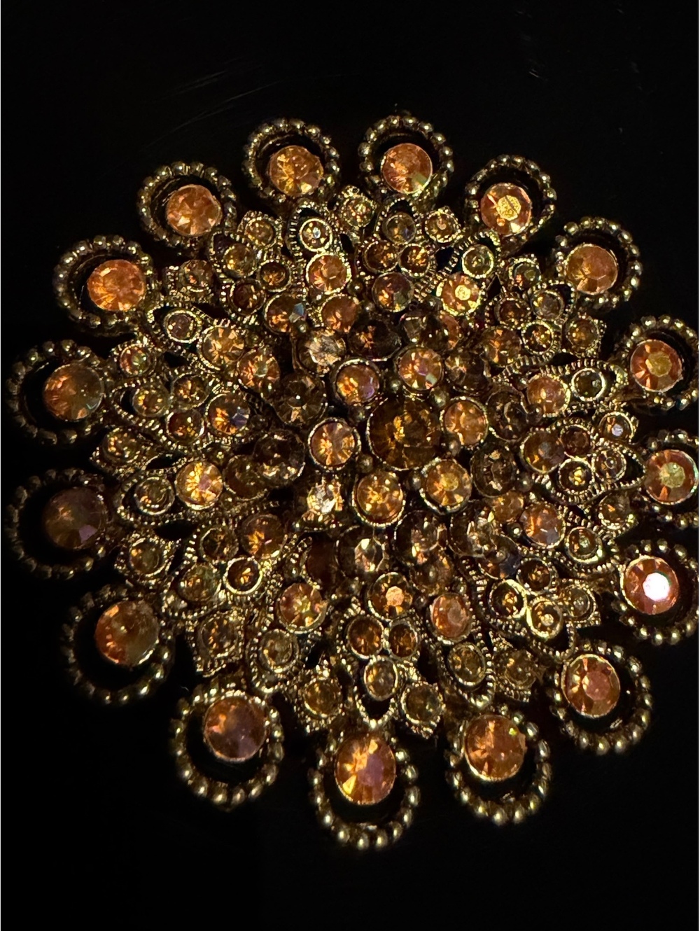 Round amber rhinestone brooch